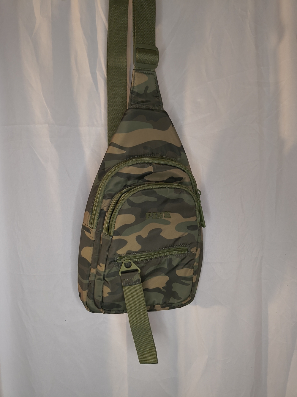 Victoria's Secret PINK Nylon Sling Backpack in a green camo pattern